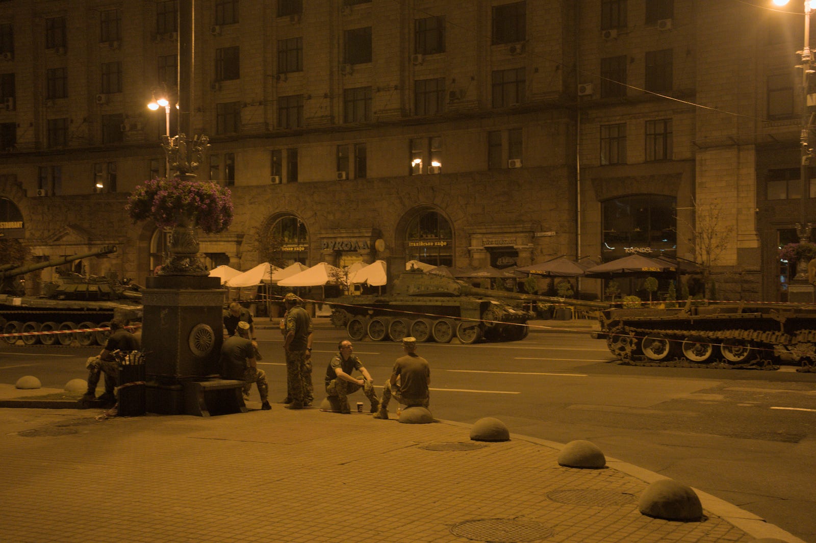 Soldiers in front the exhibited tanks